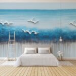 Carta da parati Pittura di uccelli che volano su un oceano blu