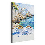 Stampa su tela Due tazze di caffè su un tavolino in riva al mare