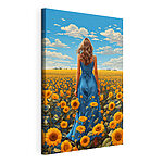 Stampa su tela Una donna con un vestito blu in un campo di girasoli